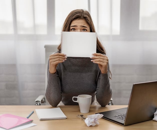 A person looking stressed while holding a letter that says 