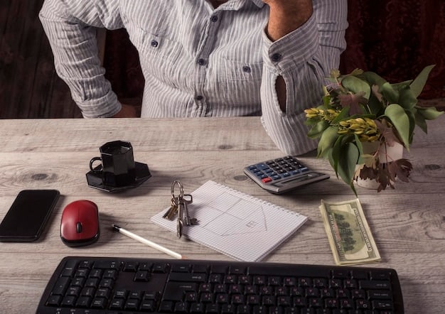 A person using a calculator while reviewing Social Security documentation at a desk, lit by natural light.