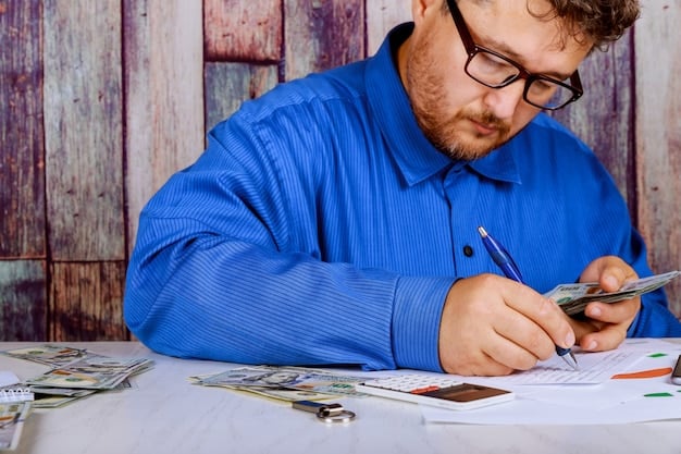 A person organizing financial documents, such as bank statements and investment portfolios, to prepare for FAFSA submission.