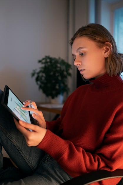 A user interacting with the Carteira de Trabalho Digital app on their tablet. The scene shows the user in a home setting, casually using technology.