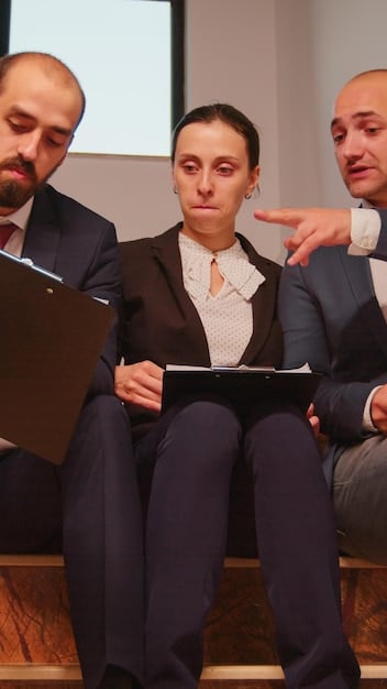 Close-up shot of a government official explaining the Bolsa Família program to a group of citizens, using visual aids and brochures. The scene should depict transparency, accessibility, and clear communication.