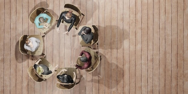A diverse group of people of various ages and backgrounds standing around a circular table with tablets and laptops, discussing investment strategies. The room appears to be a modern co-working space with charts displayed on the walls.