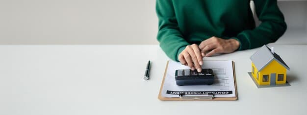 A person using a loan amortization calculator, the background is a home purchase agreement.